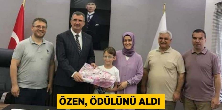 Özen, ödülünü aldı